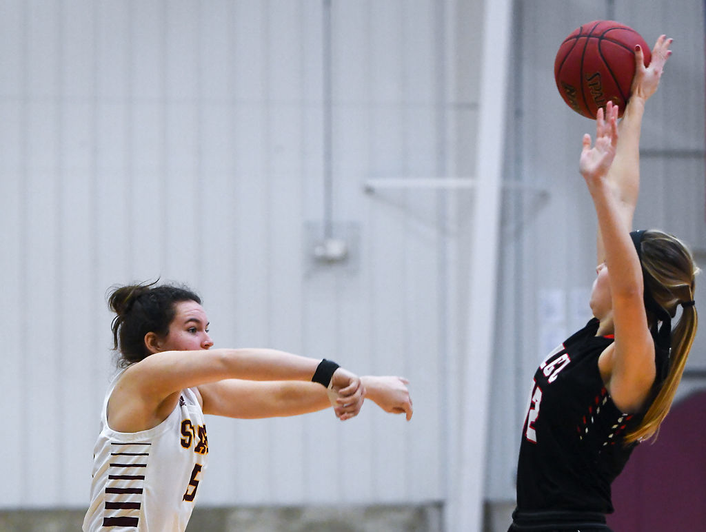 Lyndsey Hood's pass is blocked by Kenzie Schlipf